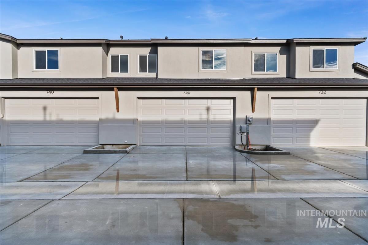 736 South Calhoun Lane Star, ID 83669 - Photo 32 of 42 View of front of home featuring stucco siding, concrete driveway, and a garage