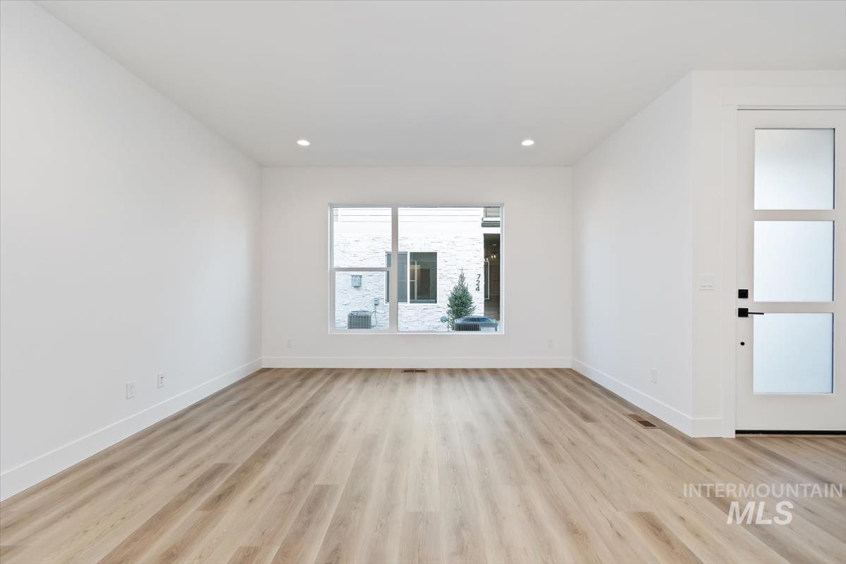 736 South Calhoun Lane Star, ID 83669 - Photo 4 of 42 Empty room with light wood-style floors and baseboards