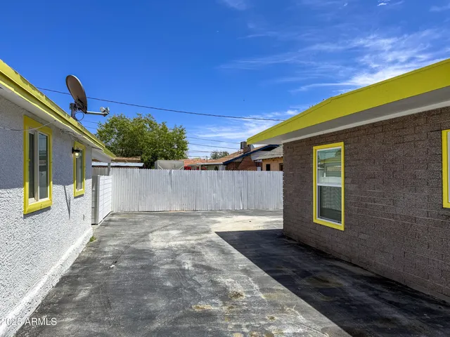 a view of a backyard with a patio