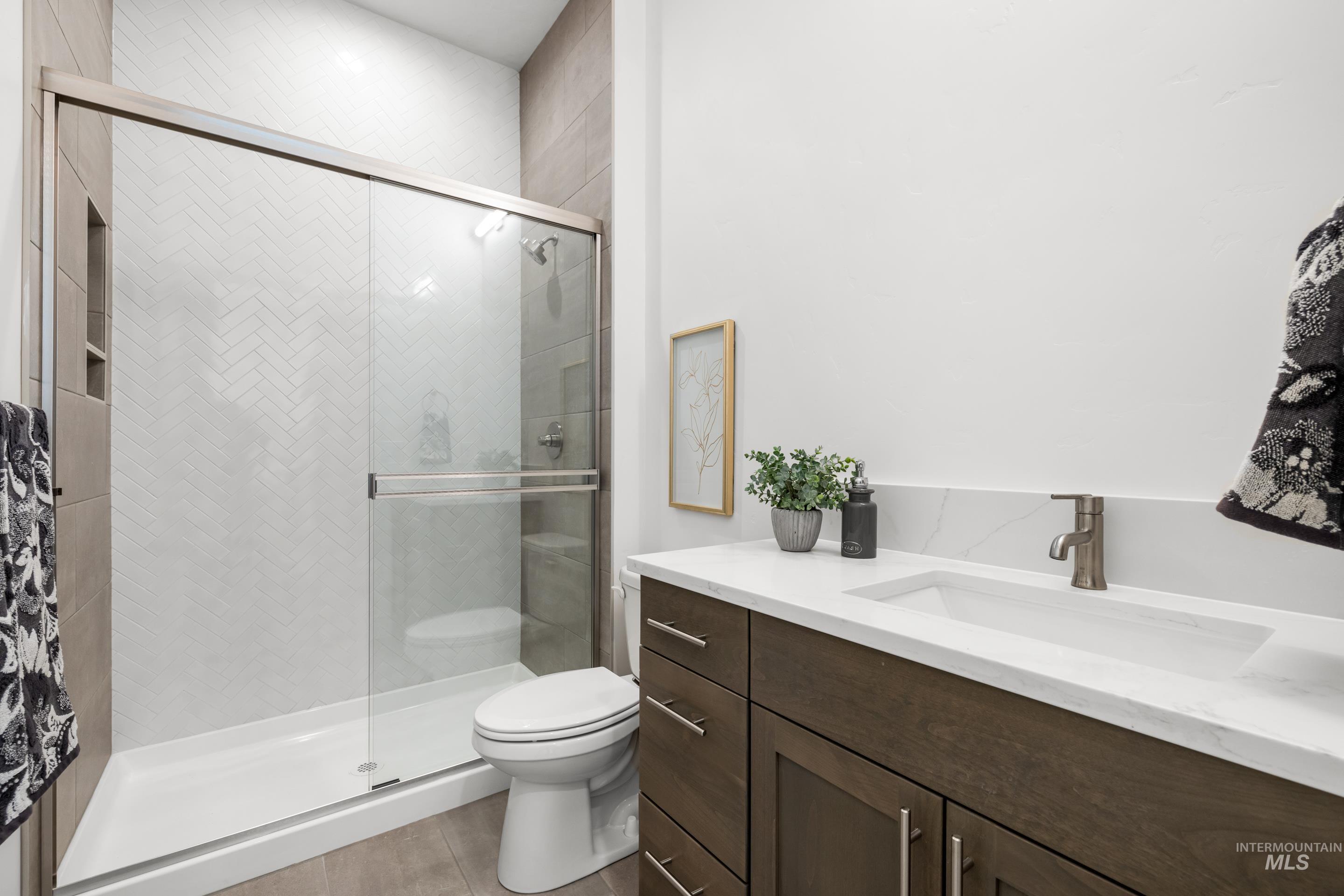 7649 West Whisper Ridge Drive, Unit ROUGE Meridian, ID 83646 - Photo 22 of 48 Full bathroom with vanity and a shower stall