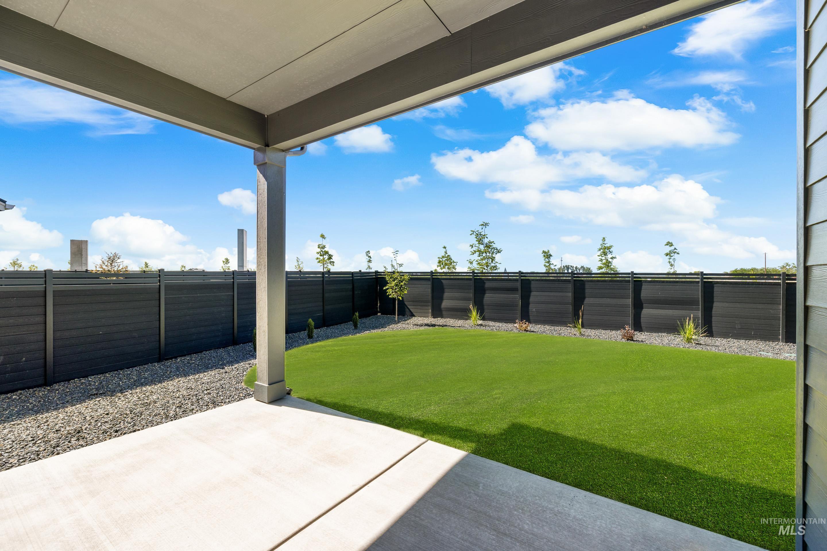 7649 West Whisper Ridge Drive, Unit ROUGE Meridian, ID 83646 - Photo 45 of 48 Fenced backyard featuring a patio