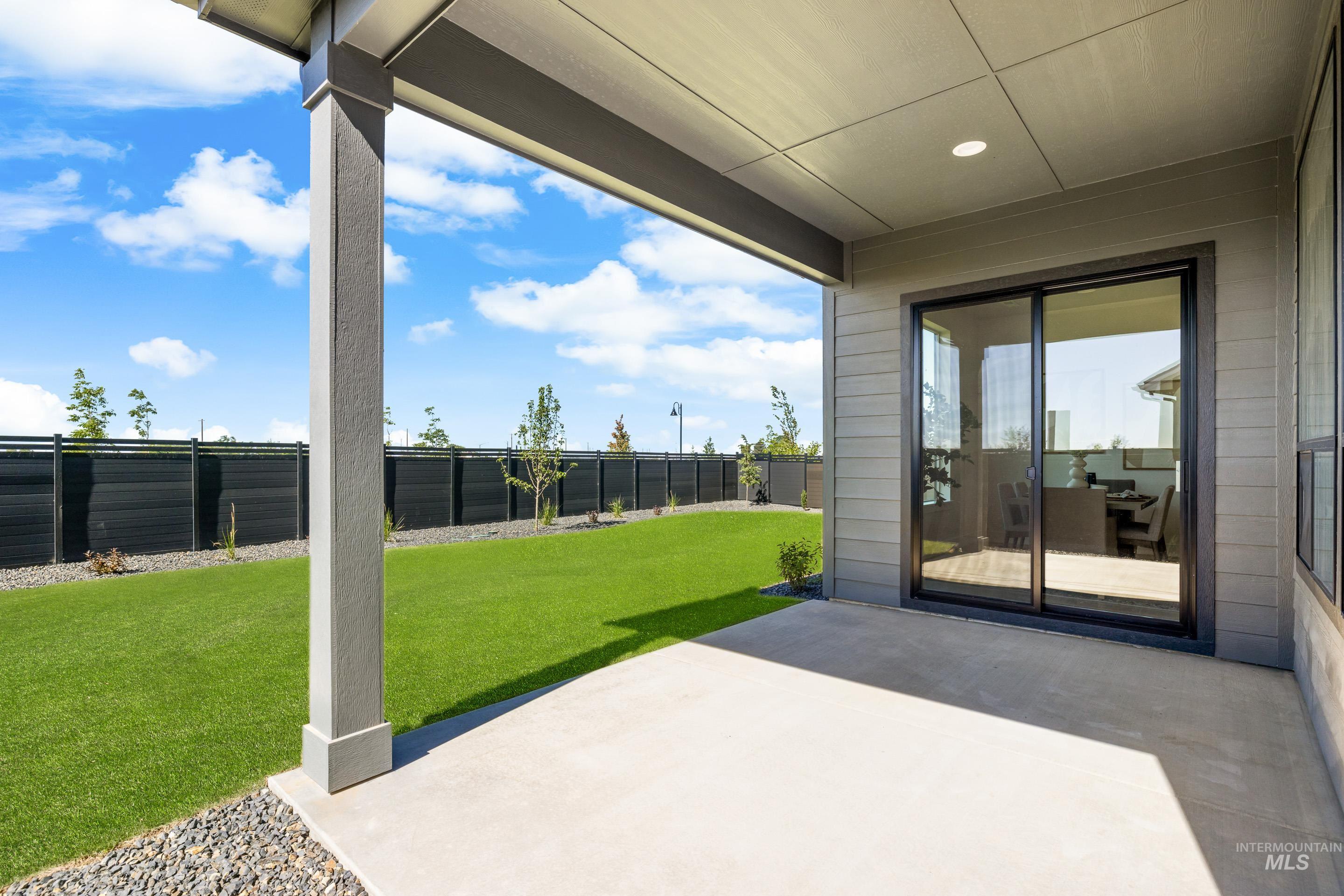7649 West Whisper Ridge Drive, Unit ROUGE Meridian, ID 83646 - Photo 46 of 48 Fenced backyard featuring a patio area
