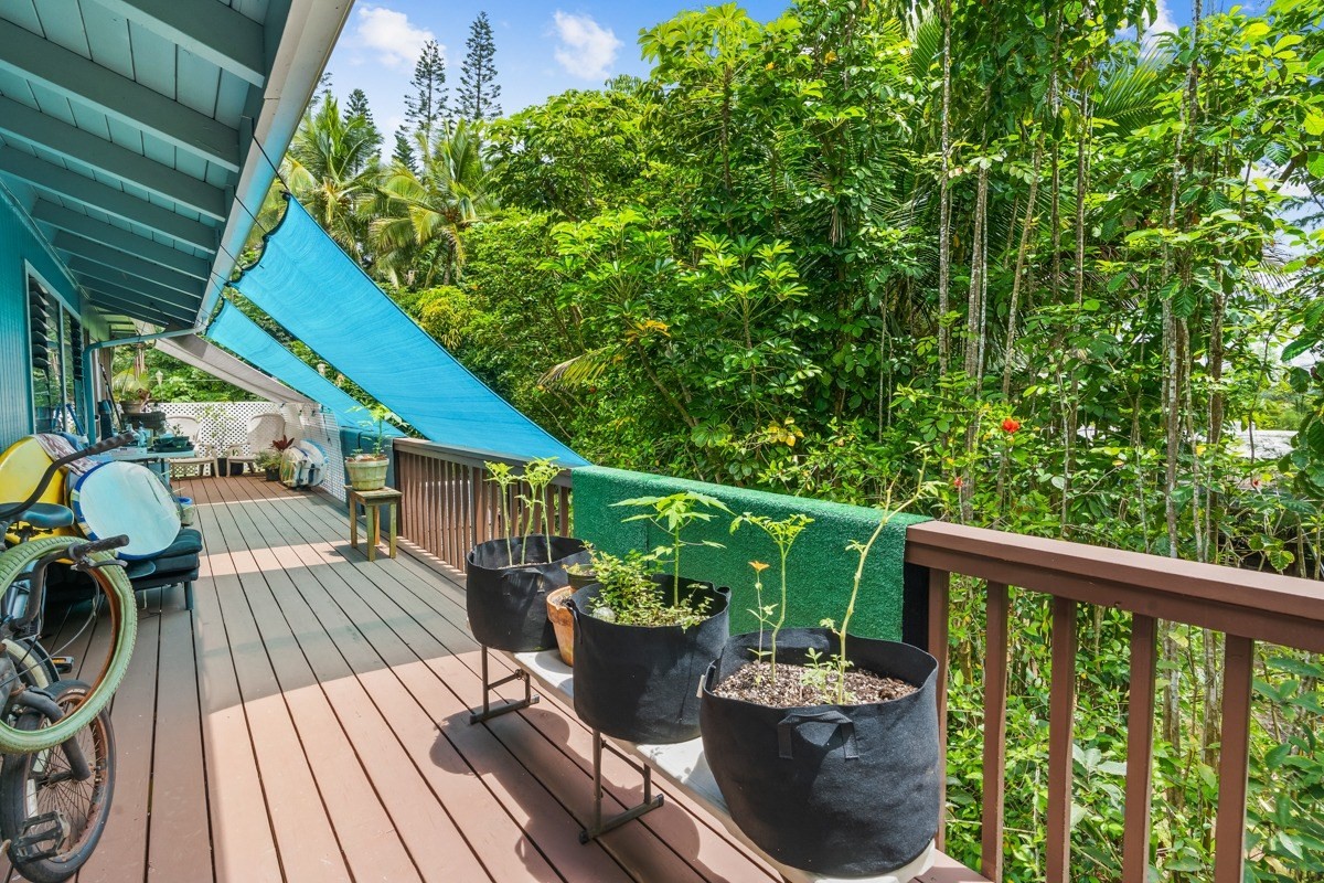 6384 Makana Road, Unit 2 Kapaa, HI 96746 - Photo 13 of 25 a view of a balcony with wooden floor