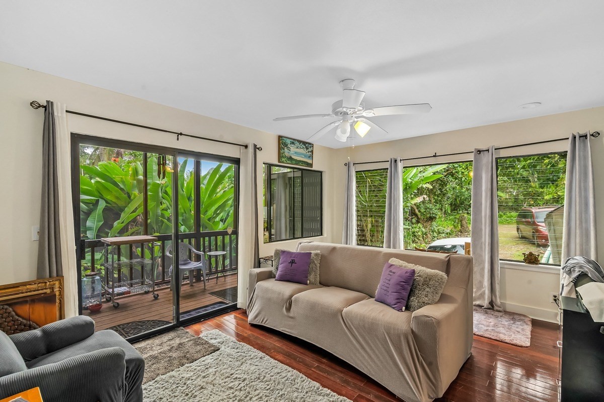 6384 Makana Road, Unit 2 Kapaa, HI 96746 - Photo 18 of 25 a living room with furniture and a large window