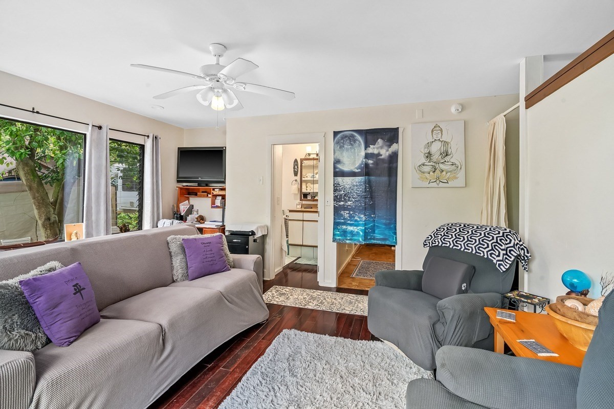 6384 Makana Road, Unit 2 Kapaa, HI 96746 - Photo 20 of 25 a living room with furniture and a large window