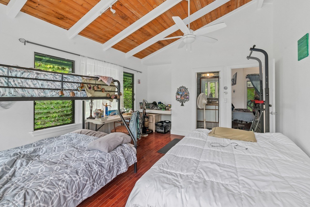 6384 Makana Road, Unit 2 Kapaa, HI 96746 - Photo 5 of 25 a large bedroom with a large bed and a large window