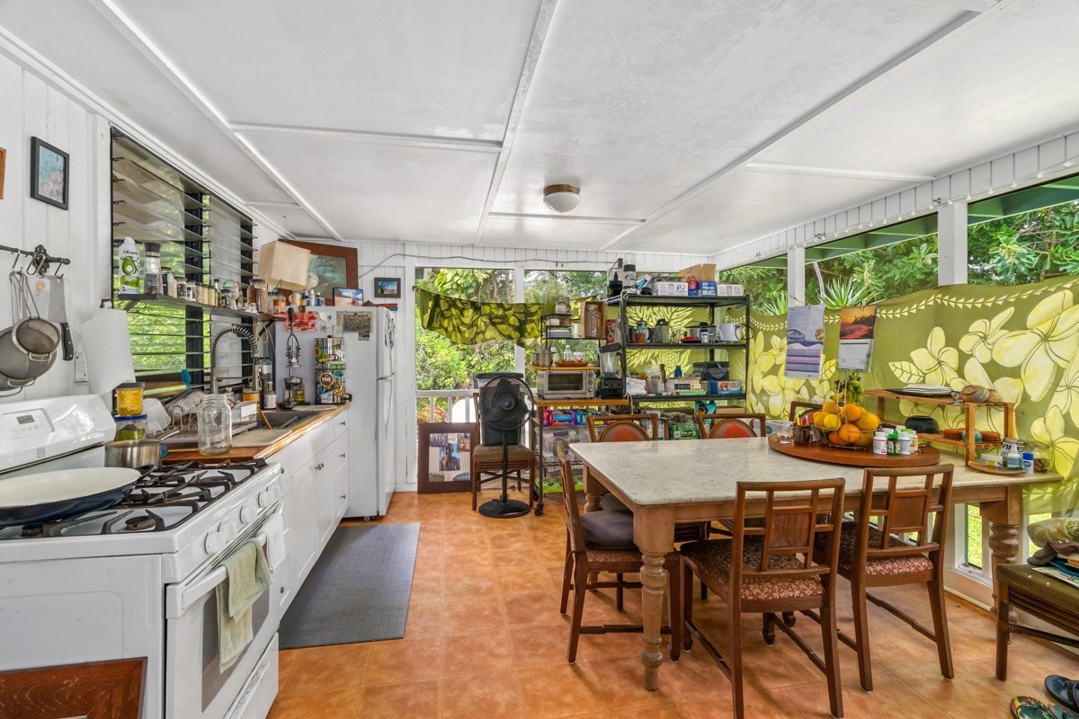 6384 Makana Road, Unit 2 Kapaa, HI 96746 - Photo 10 of 25 a room with stainless steel appliances kitchen island granite countertop furniture and a large window