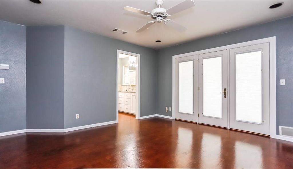 614 Twilight Trail Richardson, TX 75080 - Photo 12 of 24 a view of an empty room with wooden floor and a window