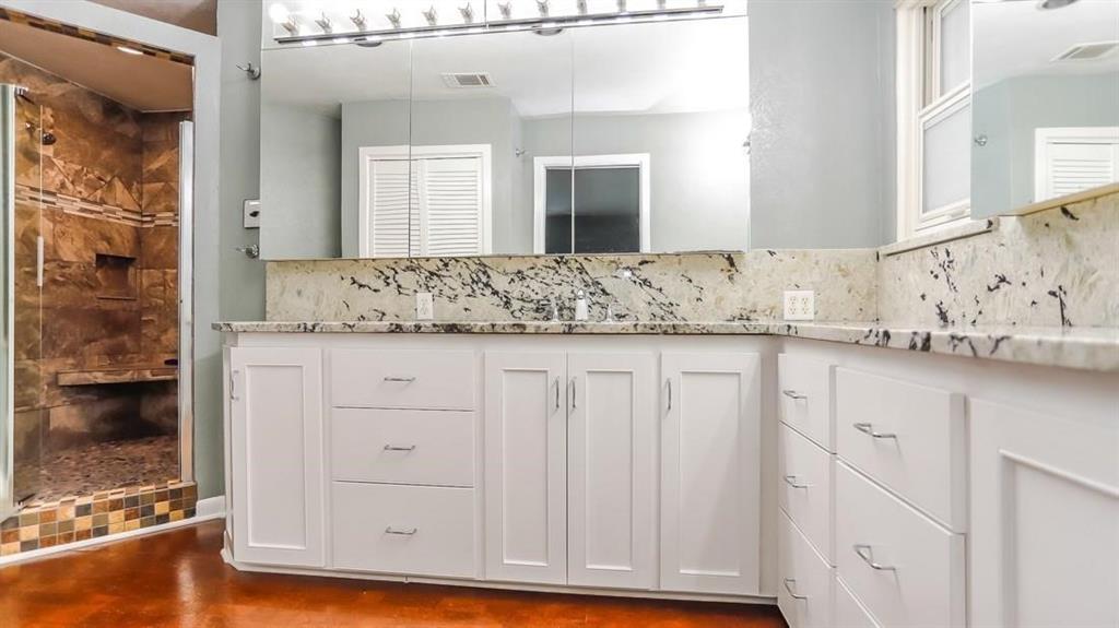 614 Twilight Trail Richardson, TX 75080 - Photo 13 of 24 a bathroom with a granite countertop sink and a mirror