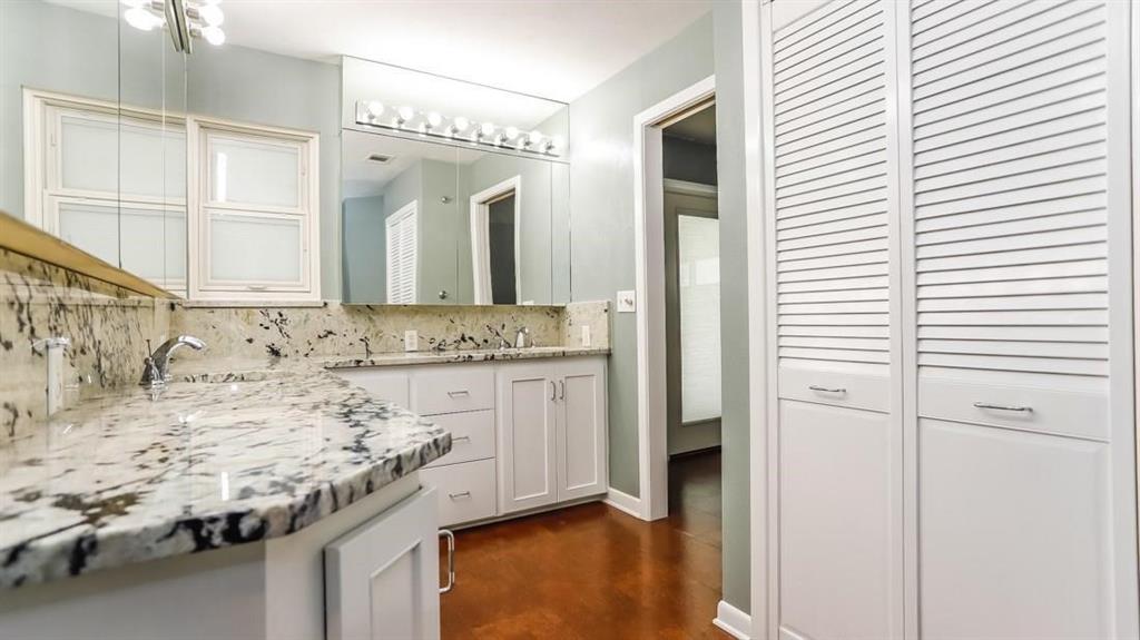 614 Twilight Trail Richardson, TX 75080 - Photo 14 of 24 a bathroom with a granite countertop sink and a mirror