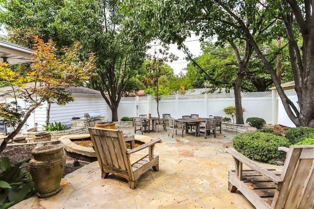 614 Twilight Trail Richardson, TX 75080 - Photo 21 of 24 a view of a patio with table and chairs and floor to ceiling window