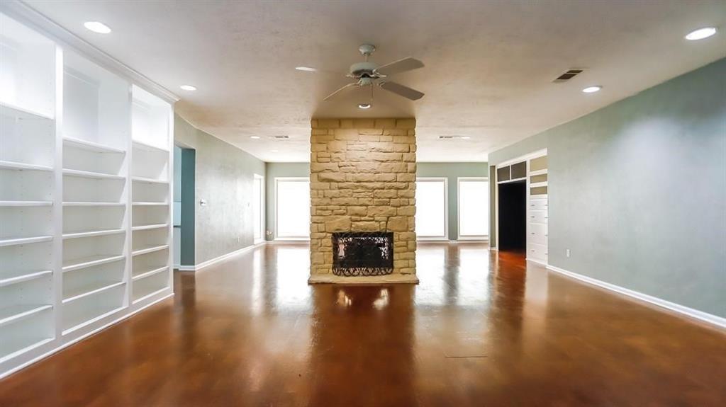 614 Twilight Trail Richardson, TX 75080 - Photo 6 of 24 a view of a livingroom with wooden floor and a fireplace