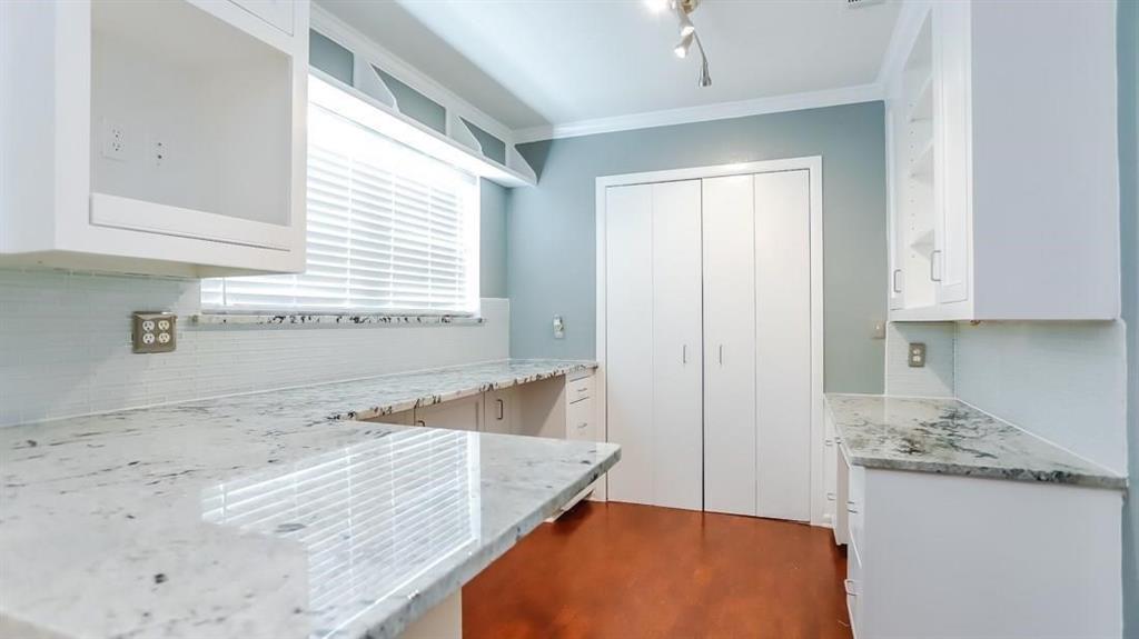 614 Twilight Trail Richardson, TX 75080 - Photo 10 of 24 a view of a kitchen cabinets and a counter place