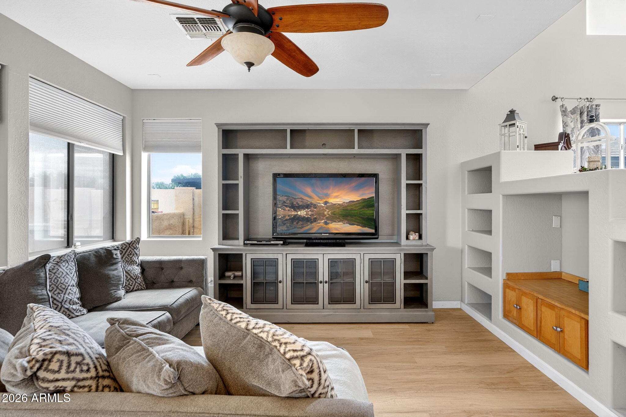 6280 South Sinova Court Gilbert, AZ 85298 - Photo 13 of 64 a living room with furniture and a flat screen tv