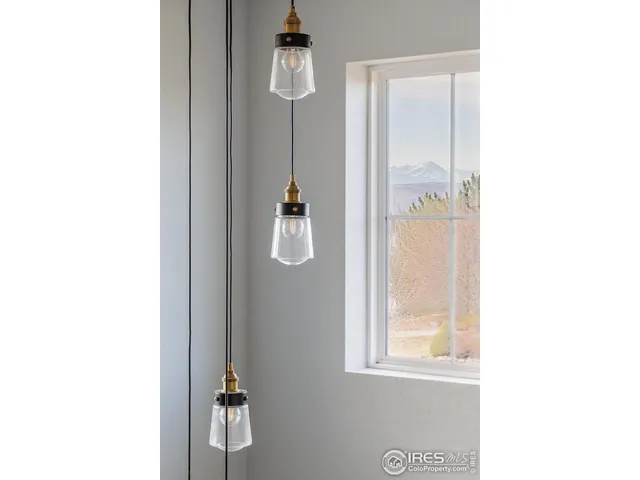 a view of hallway with furniture and a fan