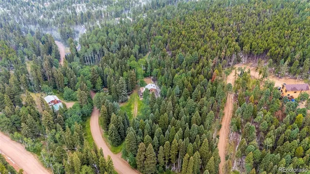 a view of a house with a tree