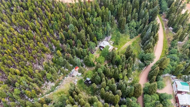 a view of a house with a mountain in the background