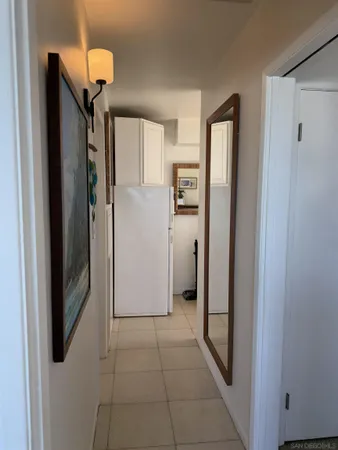 a kitchen with a sink a stove and a refrigerator