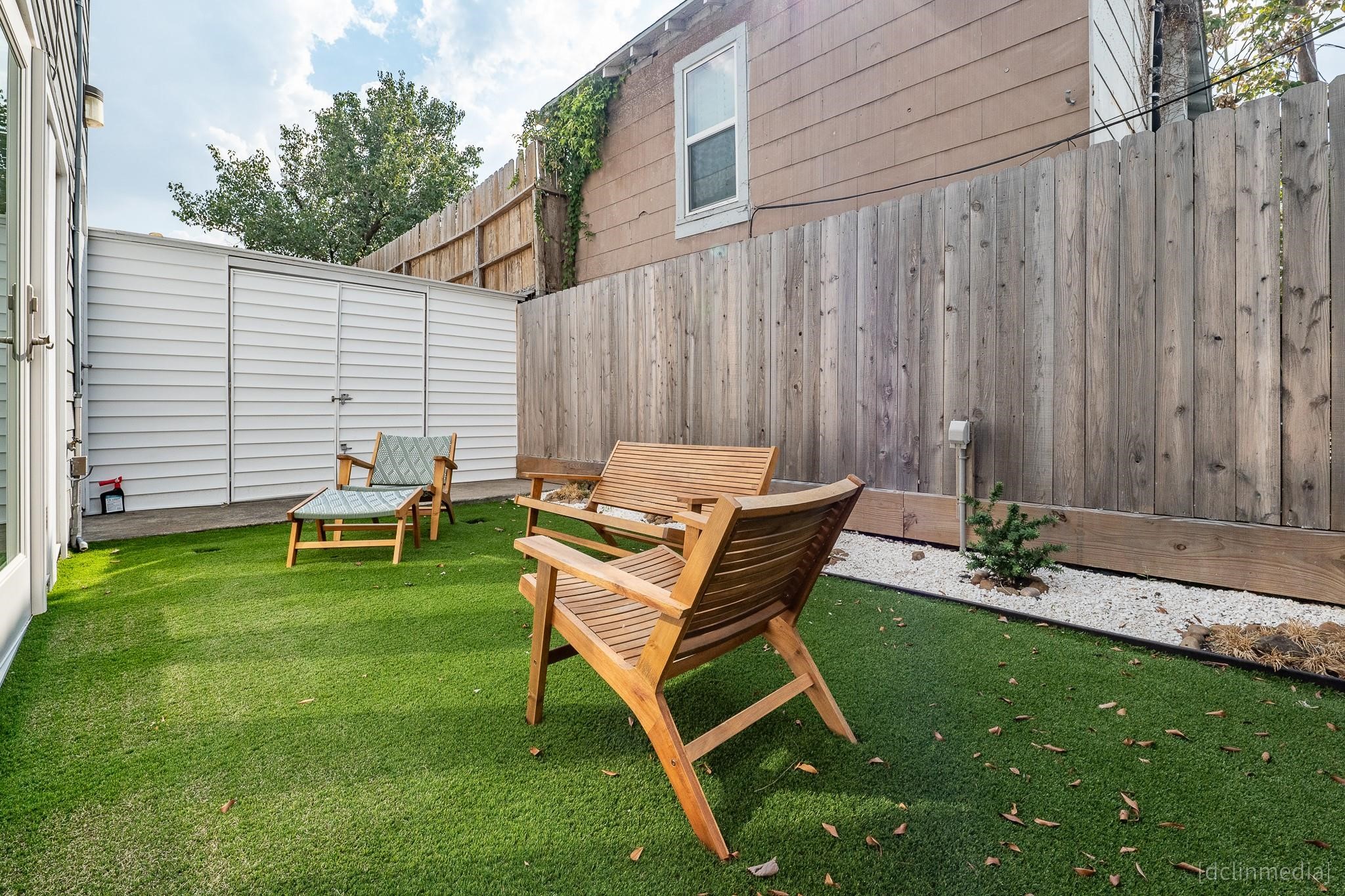 2002 Norfolk Street, Unit A Houston, TX 77098 - Photo 26 of 35 a backyard of a house with table and chairs