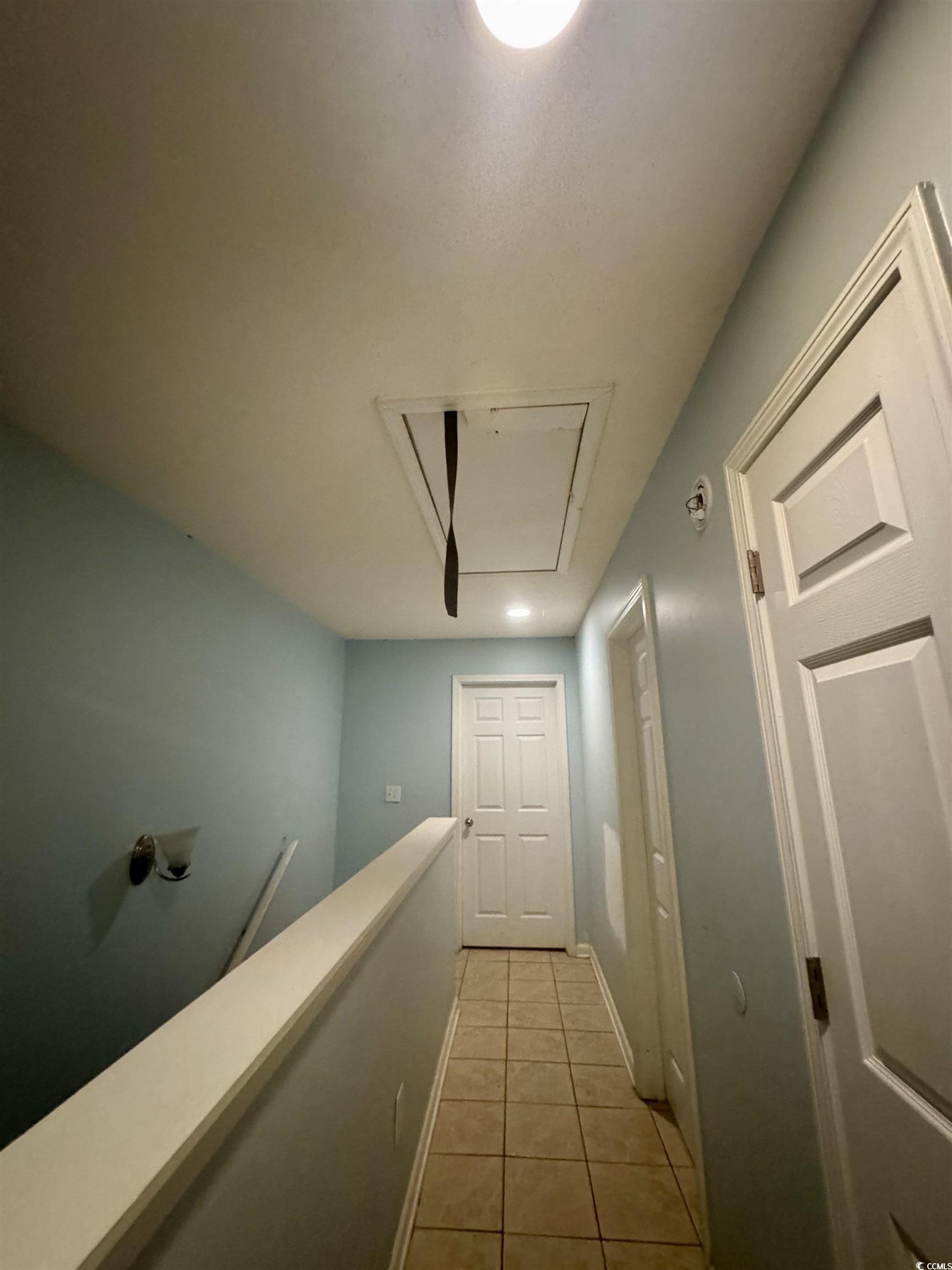 1207 Pinegrove Drive, Unit D Myrtle Beach, SC 29577 - Photo 12 of 16 Bedroom with light wood-style floors and a textured ceiling