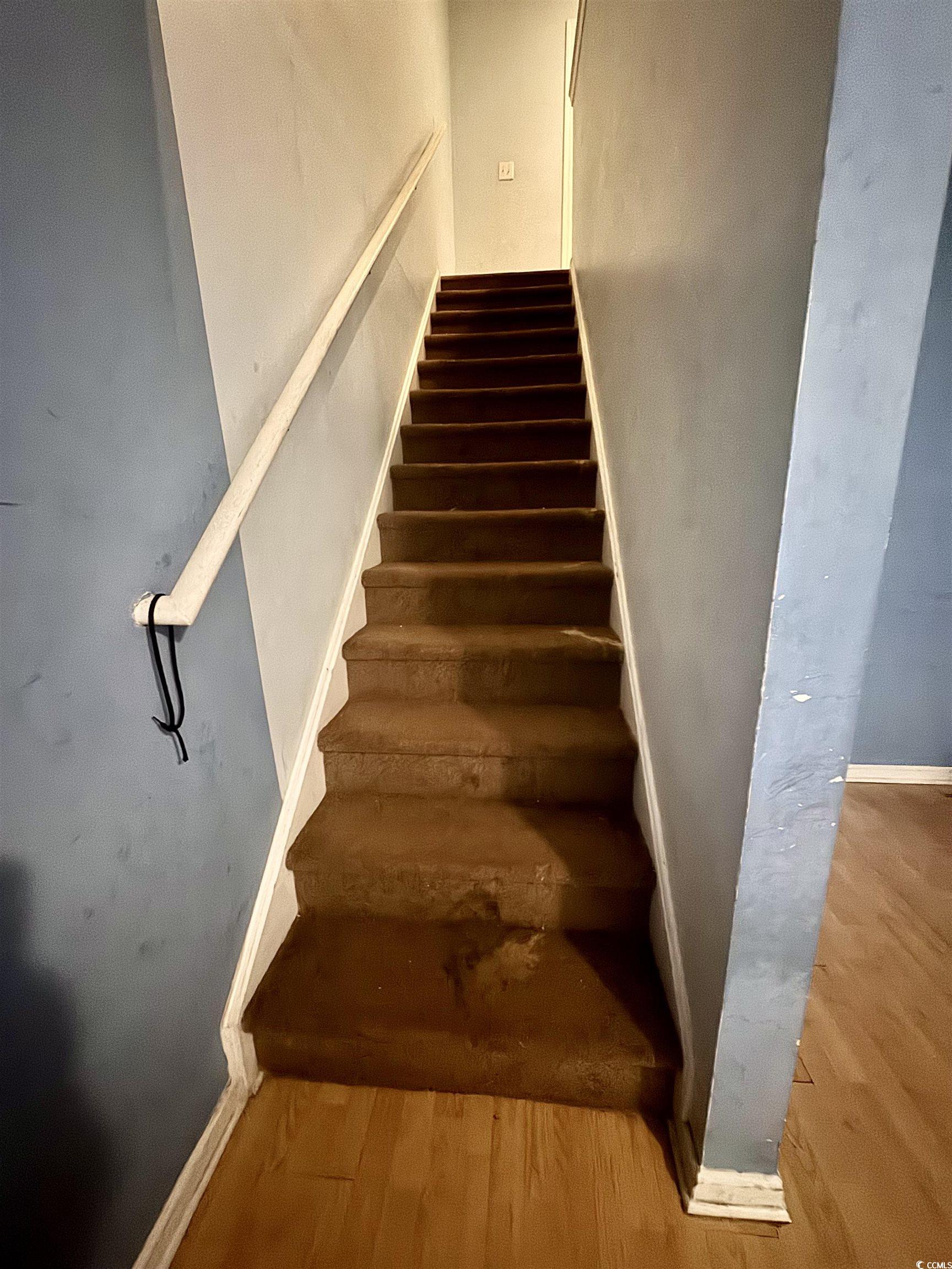 1207 Pinegrove Drive, Unit D Myrtle Beach, SC 29577 - Photo 7 of 16 Living room with wood finished floors and a textured ceiling