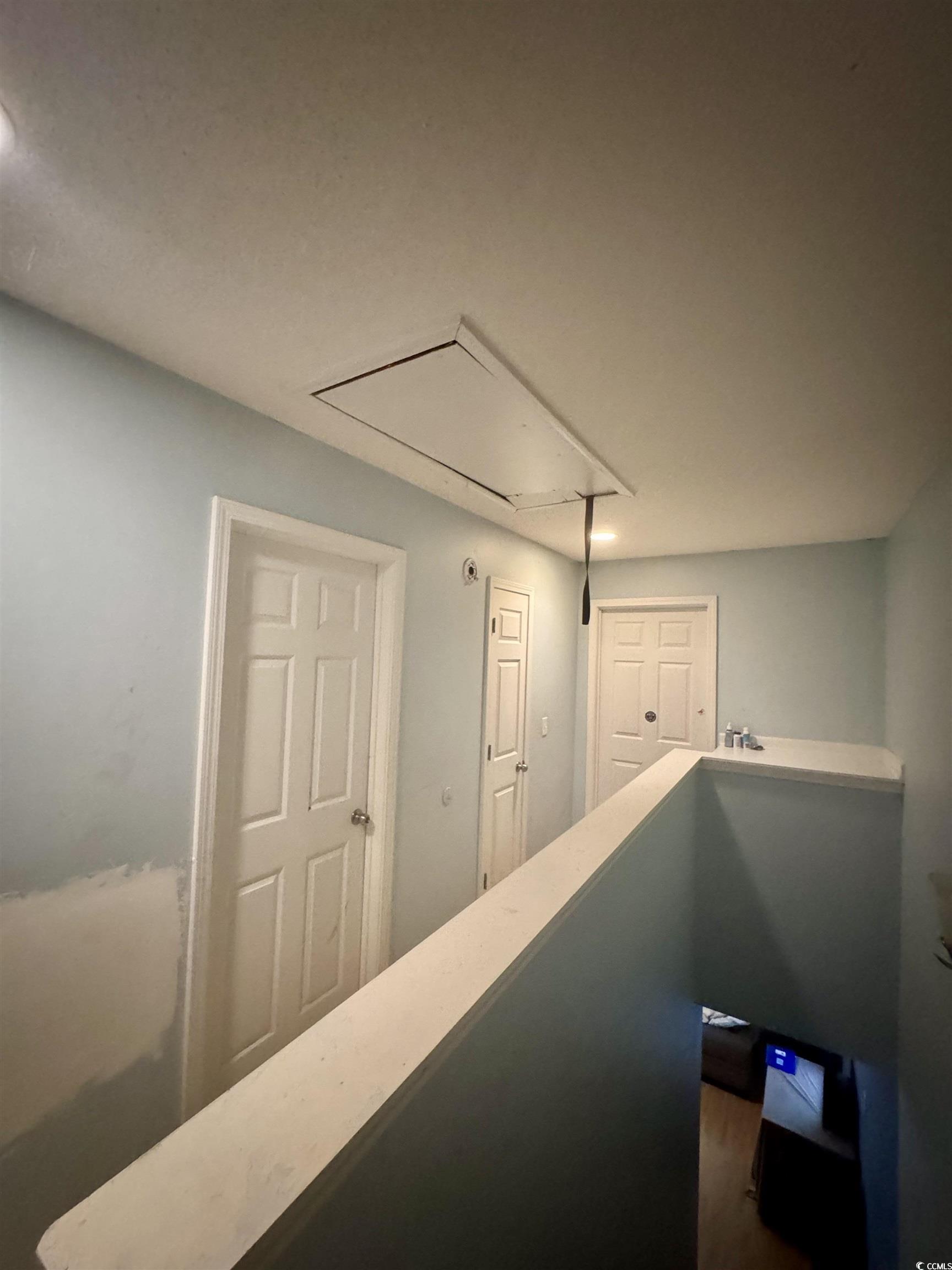 1207 Pinegrove Drive, Unit D Myrtle Beach, SC 29577 - Photo 8 of 16 Stairway featuring baseboards and wood finished floors