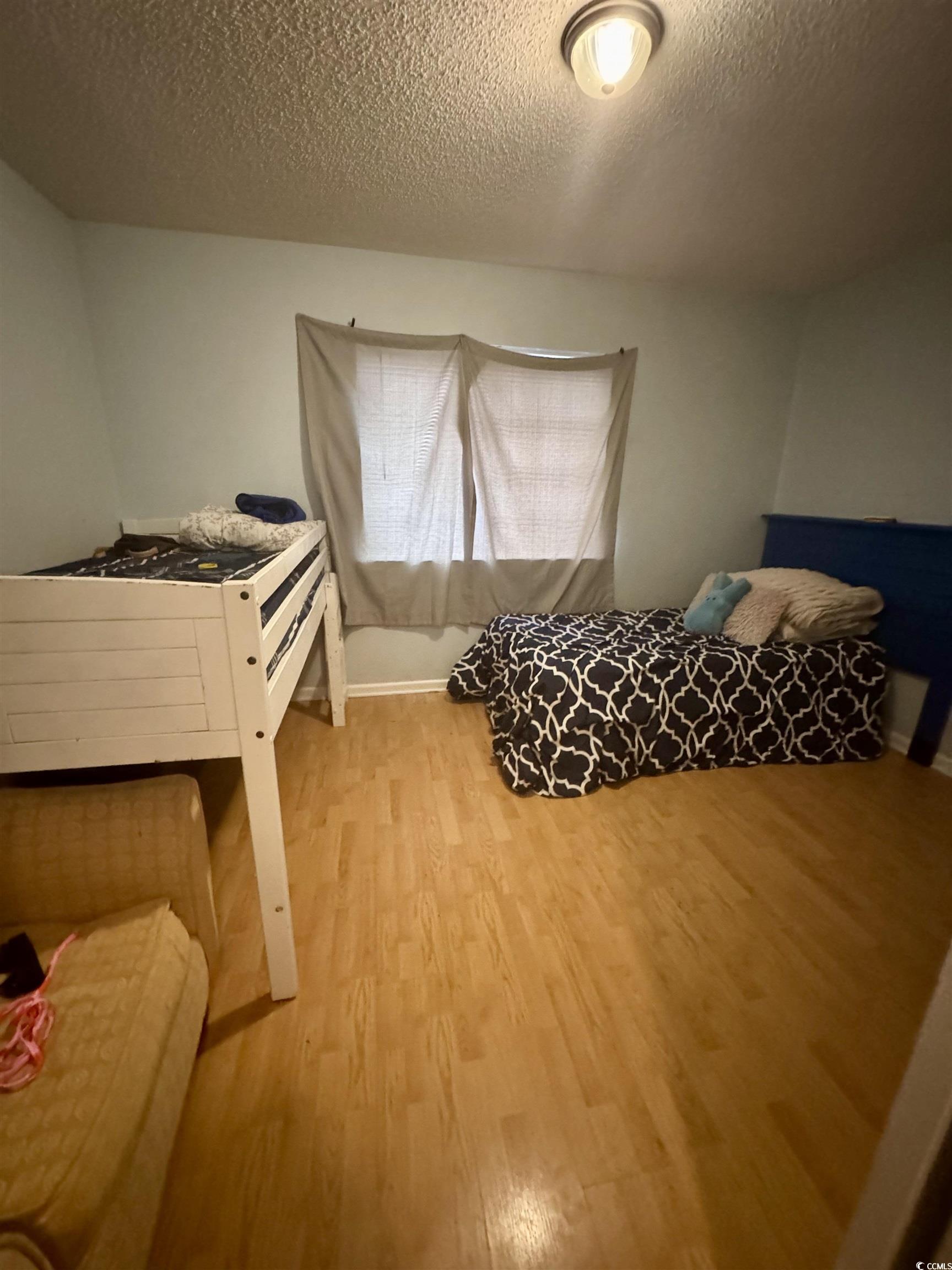 1207 Pinegrove Drive, Unit D Myrtle Beach, SC 29577 - Photo 9 of 16 Hallway with attic access, an upstairs landing, and wood finished floors
