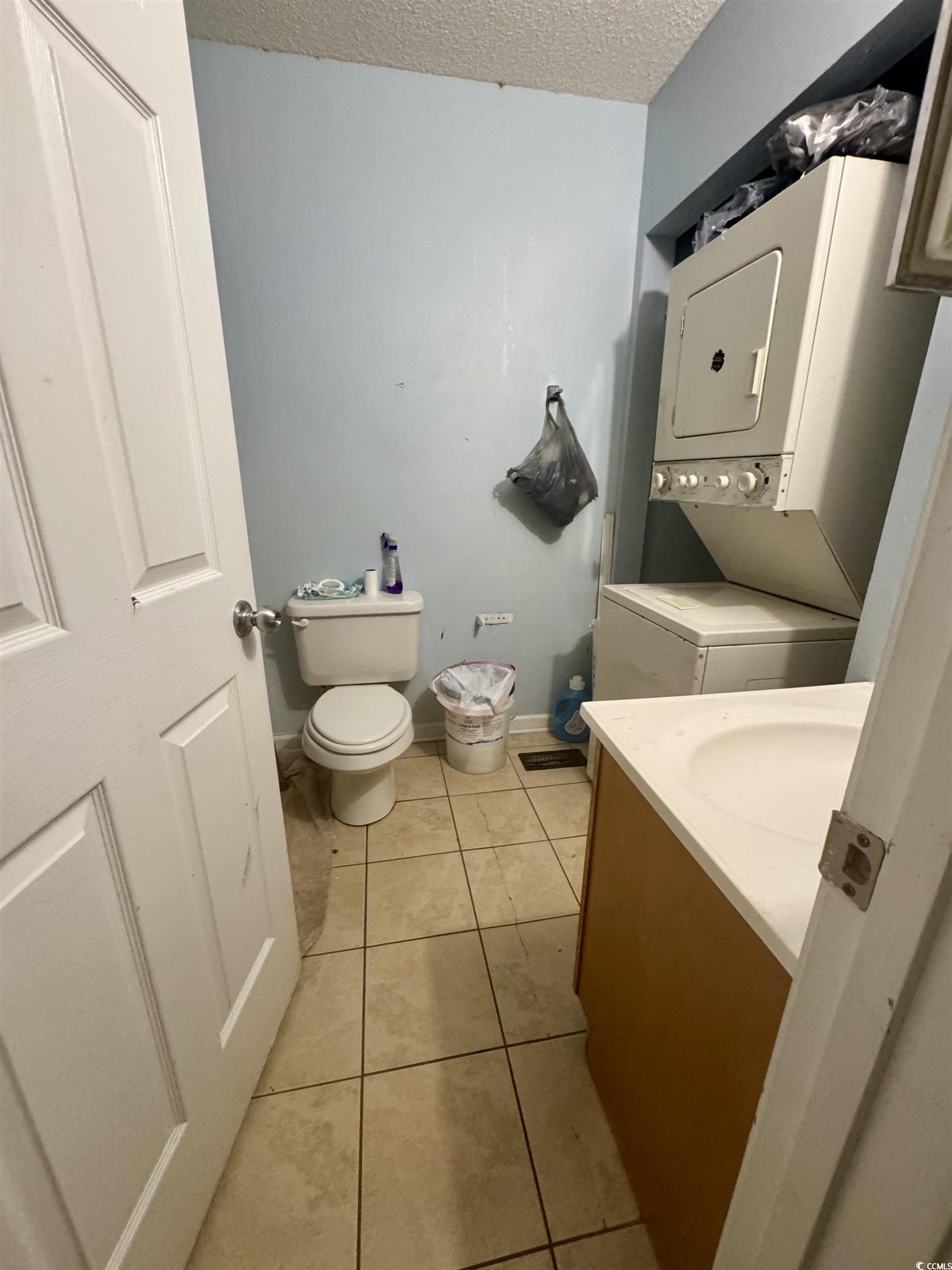 1207 Pinegrove Drive, Unit D Myrtle Beach, SC 29577 - Photo 10 of 16 Bedroom with light wood-style floors and a textured ceiling