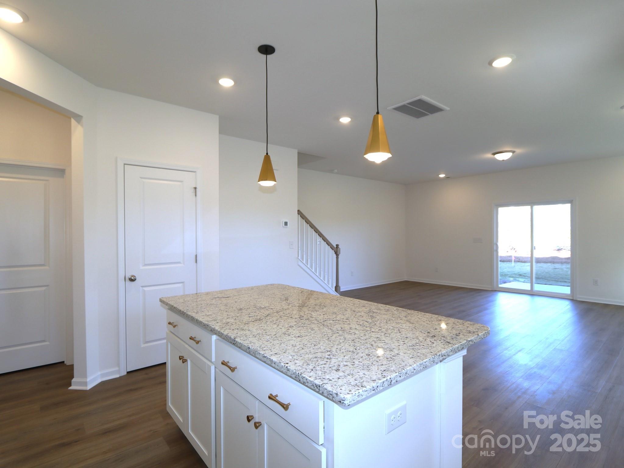 1014 Overbrook Place Wingate, NC 28174 - Photo 6 of 21 a kitchen with a sink and center island