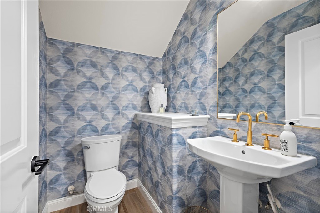 3 Tranquility Place Ladera Ranch, CA 92694 - Photo 37 of 63 a bathroom with a sink a toilet and mirror