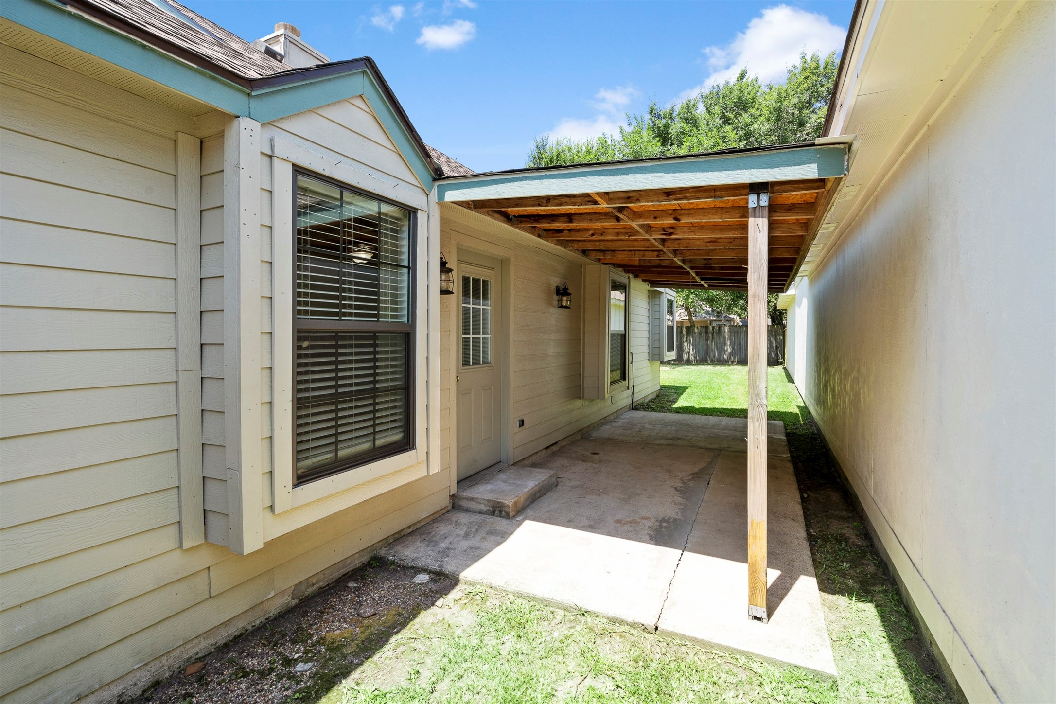 22835 Sherioaks Lane Spring, TX 77389 - Photo 10 of 12 the covered patio is the perfect spot for relaxing.