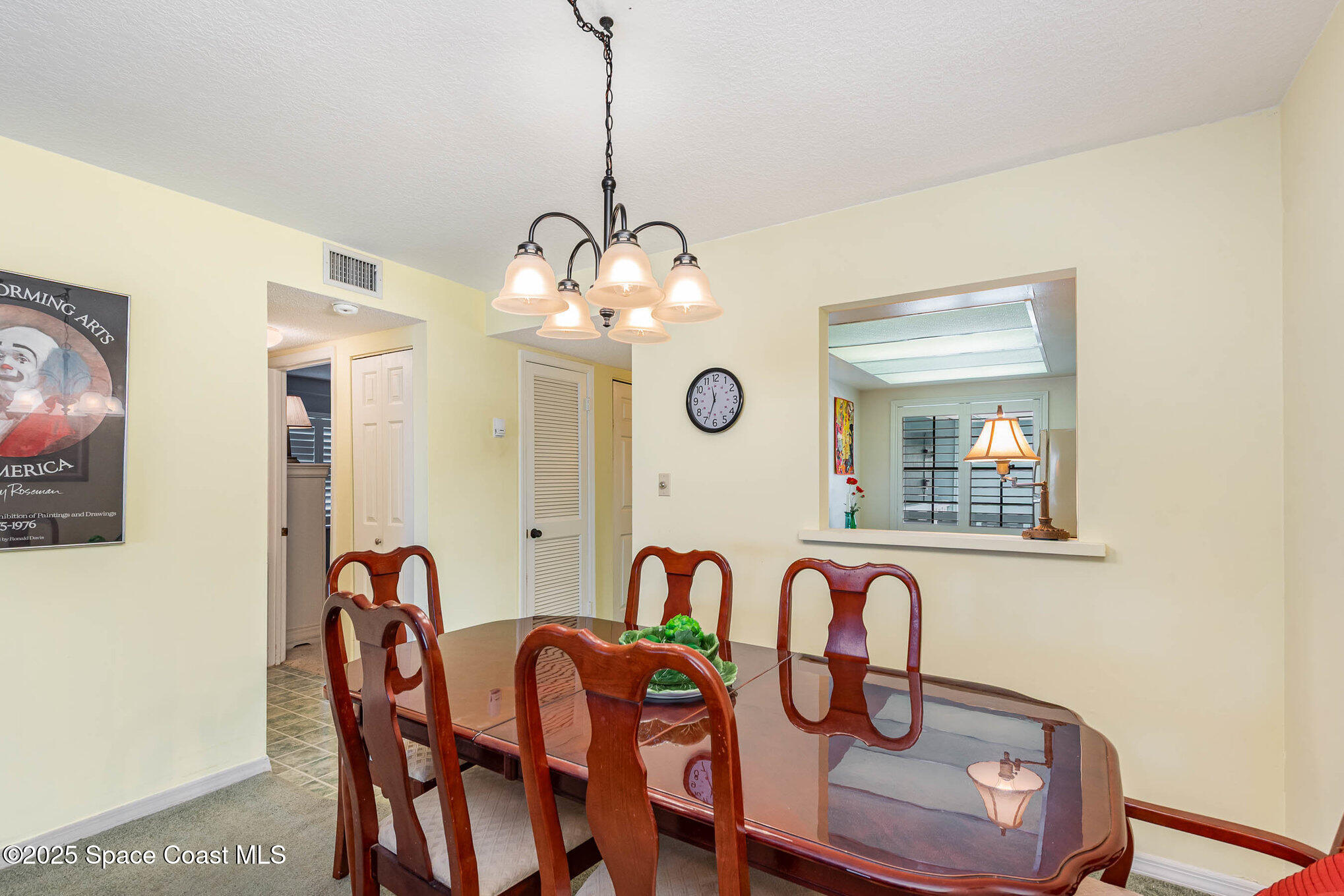 1999 South Banana River Boulevard, Unit 313 Cocoa Beach, FL 32931 - Photo 13 of 24 a dining room with furniture and chandelier
