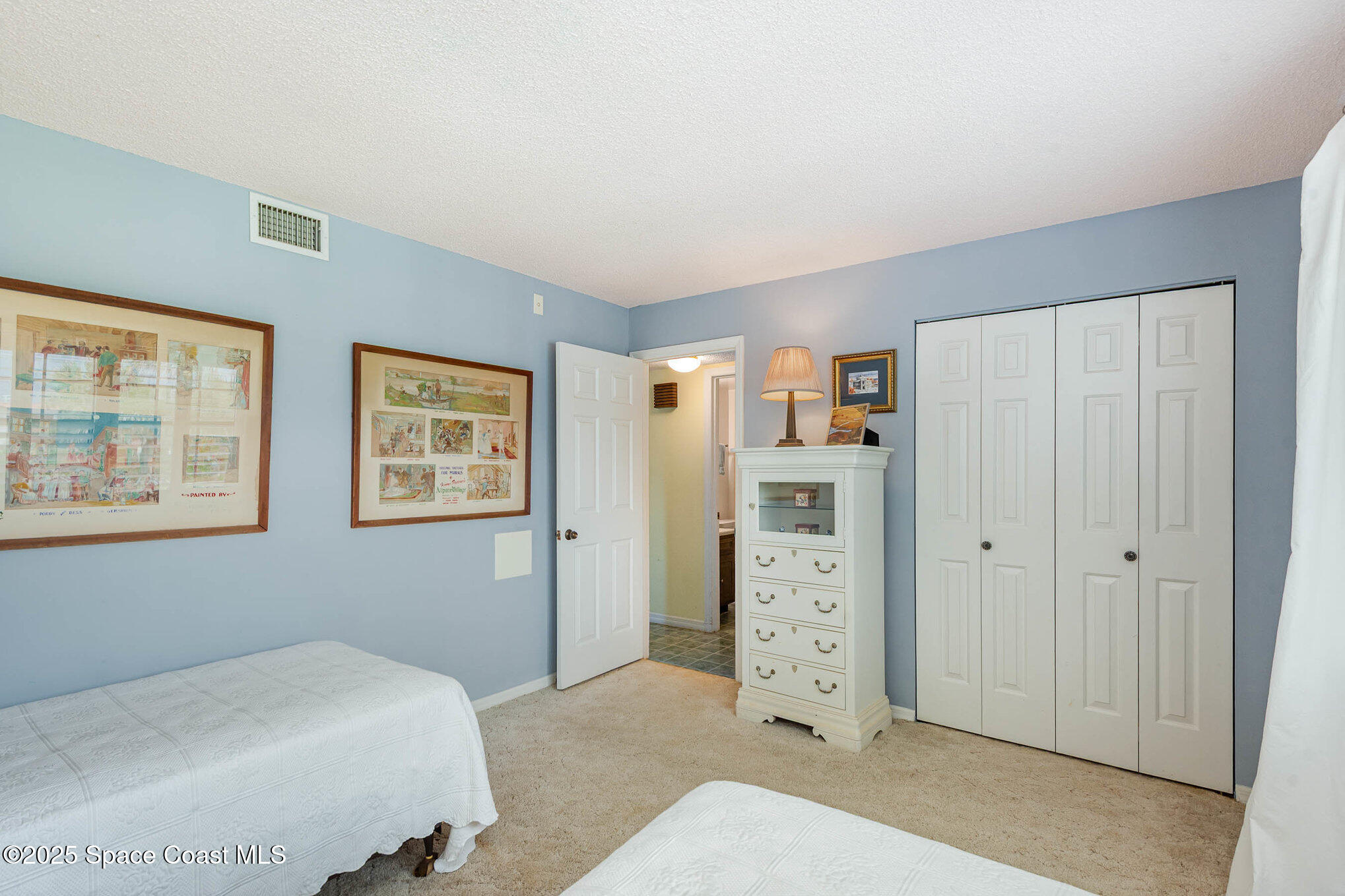 1999 South Banana River Boulevard, Unit 313 Cocoa Beach, FL 32931 - Photo 16 of 24 a bedroom with a bed and a window