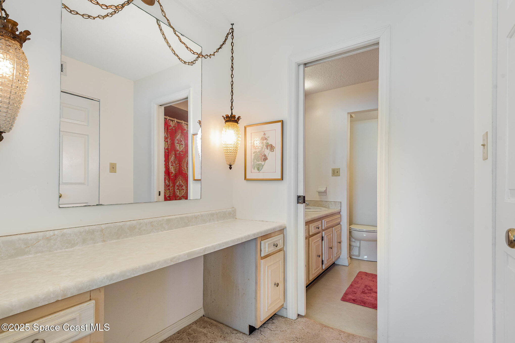 1999 South Banana River Boulevard, Unit 313 Cocoa Beach, FL 32931 - Photo 17 of 24 a bathroom with a sink and a mirror