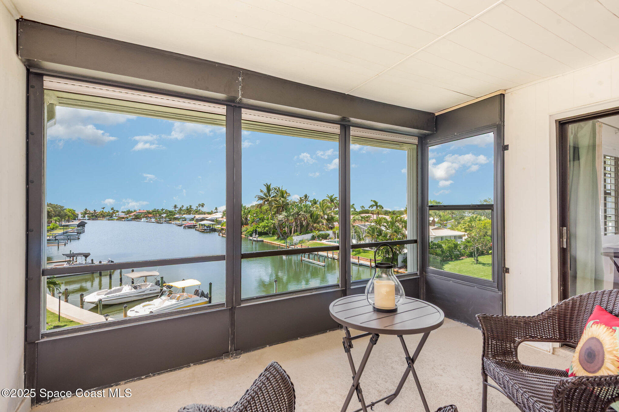1999 South Banana River Boulevard, Unit 313 Cocoa Beach, FL 32931 - Photo 3 of 24 a room with furniture and a window