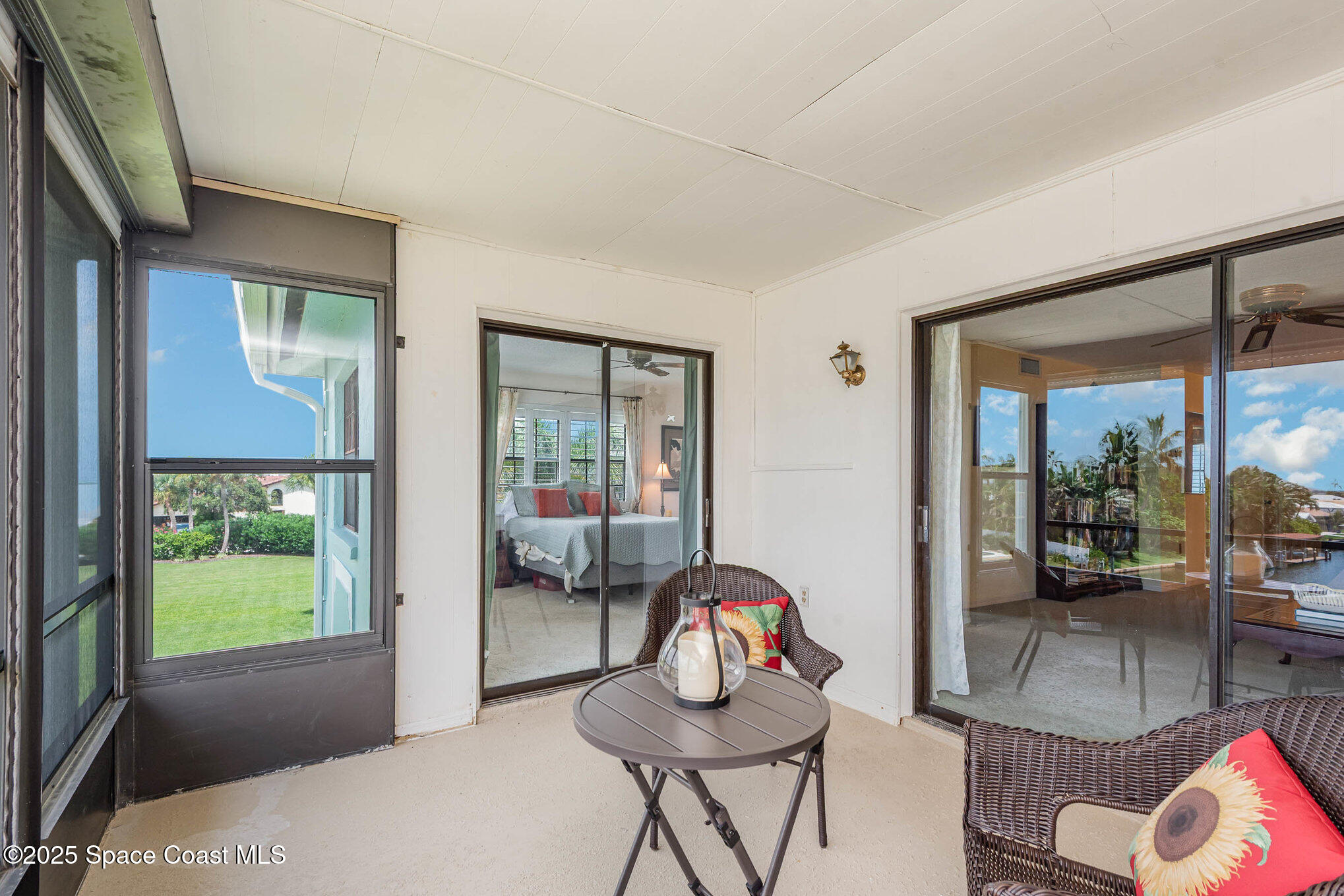1999 South Banana River Boulevard, Unit 313 Cocoa Beach, FL 32931 - Photo 5 of 24 a living room with furniture and a window