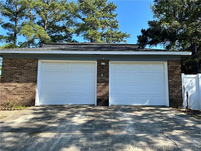 a couple of potted plants in front of door