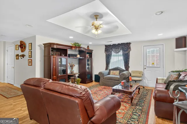 a kitchen with stainless steel appliances granite countertop a refrigerator and a stove