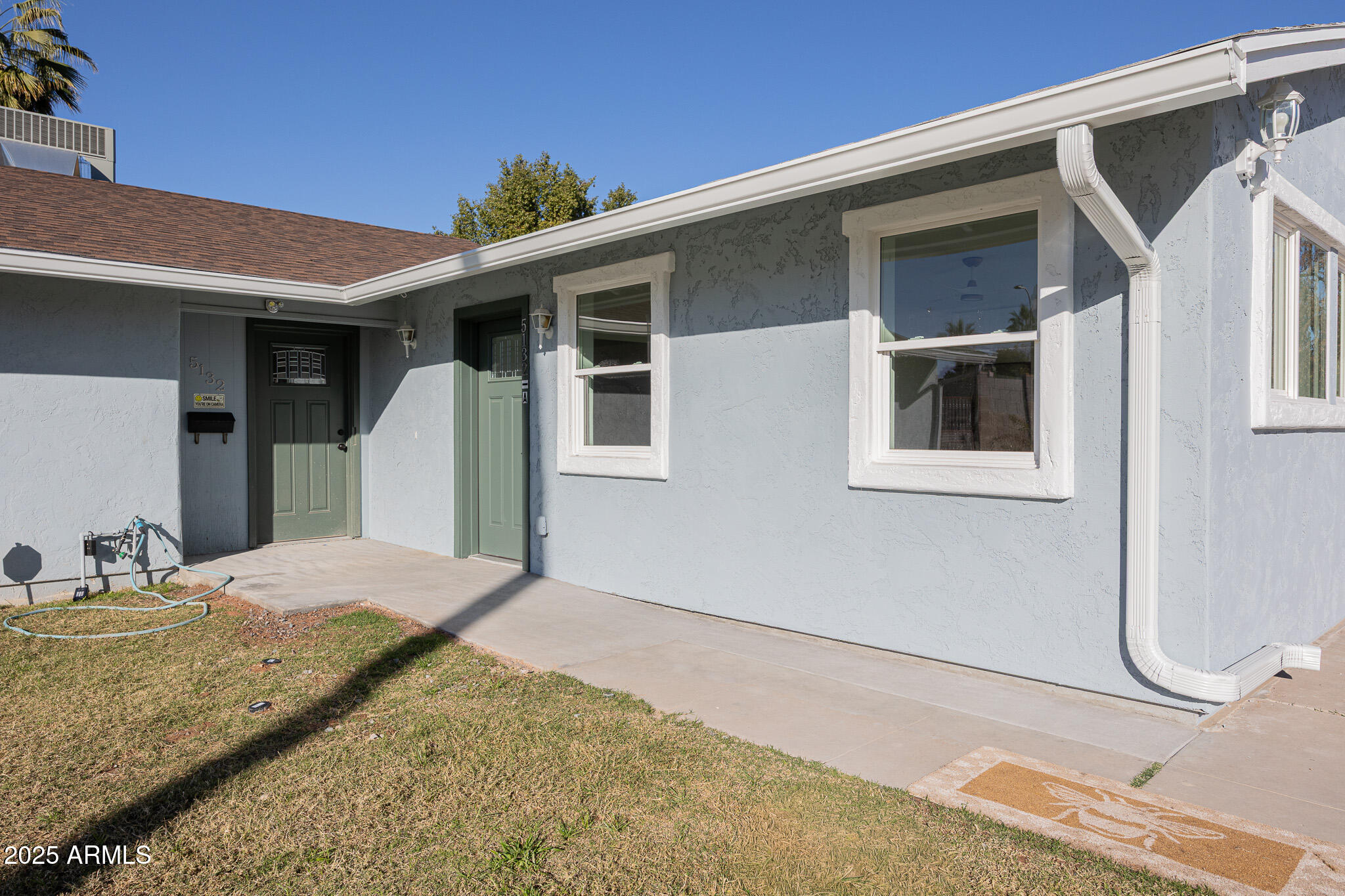 a view of a house with a backyard