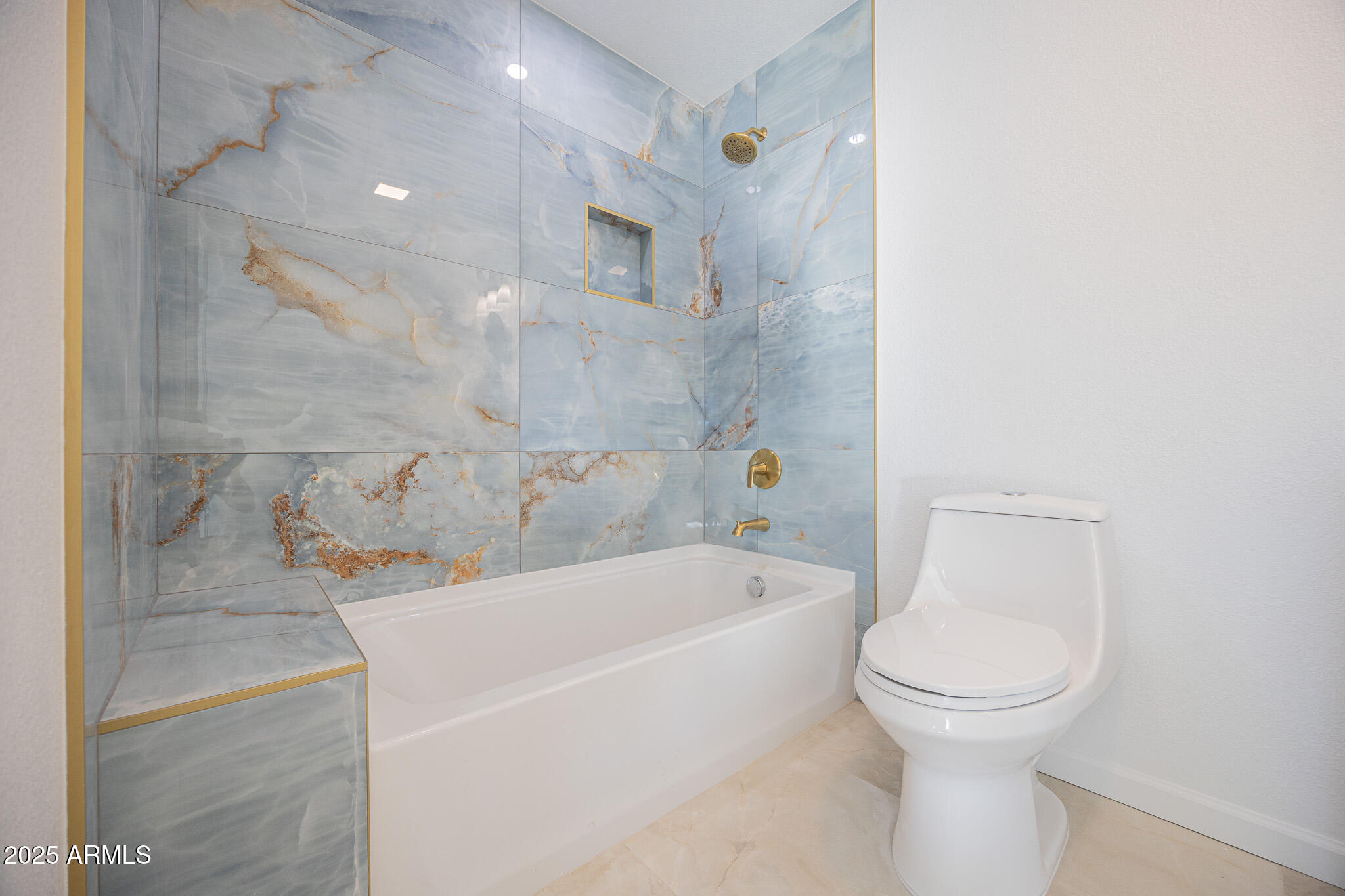 5132 South Dorsey Lane, Unit A Tempe, AZ 85282 - Photo 11 of 15 a white bath tub sitting next to a white toilet