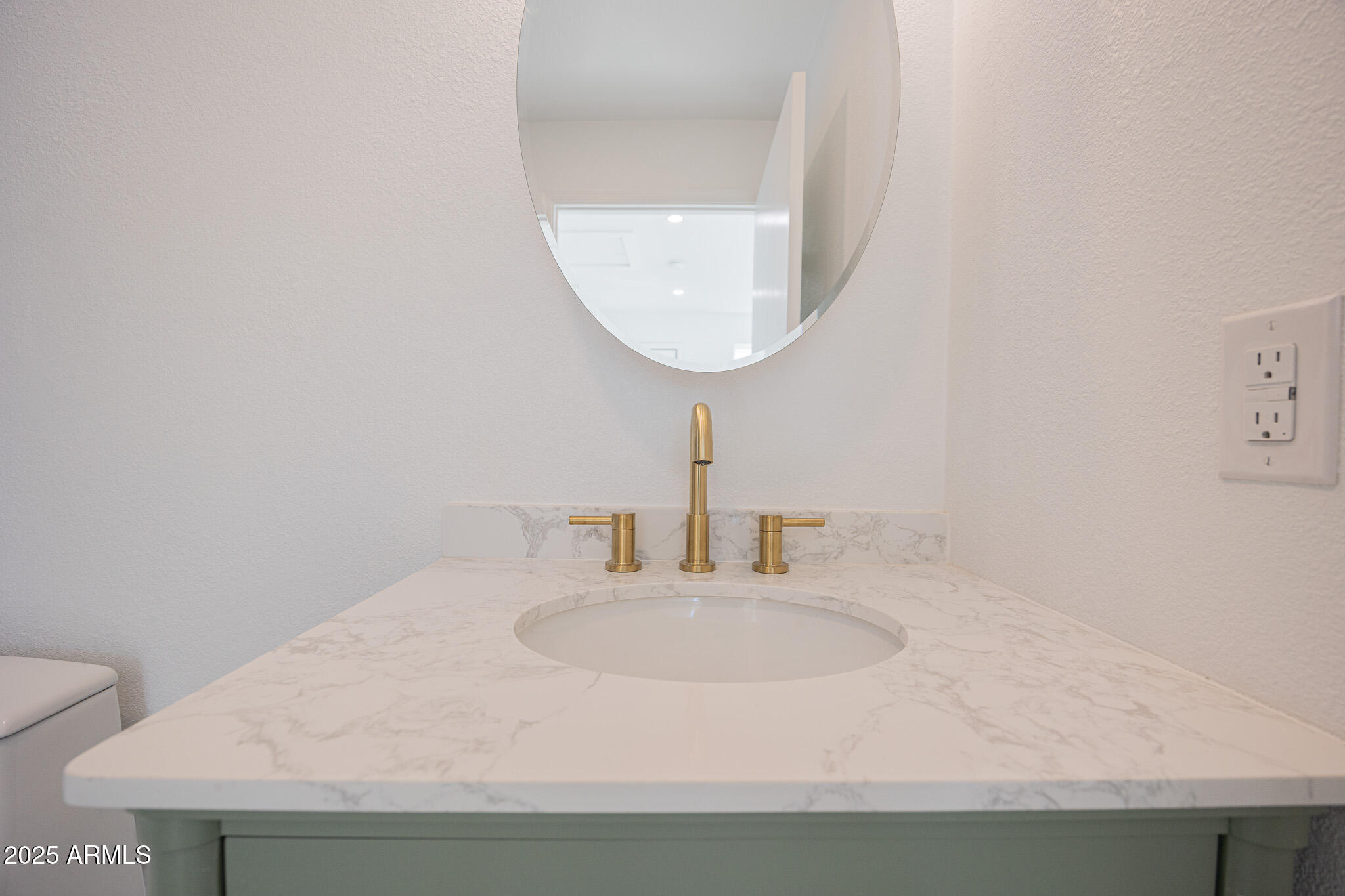 5132 South Dorsey Lane, Unit A Tempe, AZ 85282 - Photo 13 of 15 a bathroom with a sink and a mirror