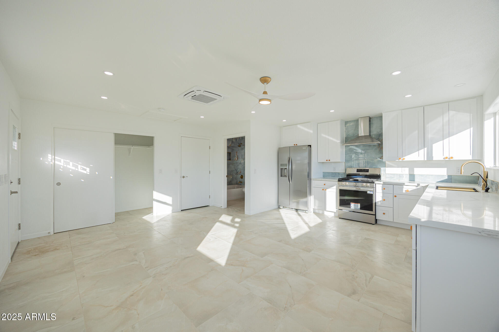 5132 South Dorsey Lane, Unit A Tempe, AZ 85282 - Photo 5 of 15 a view of kitchen with stainless steel appliances refrigerator oven and cabinets