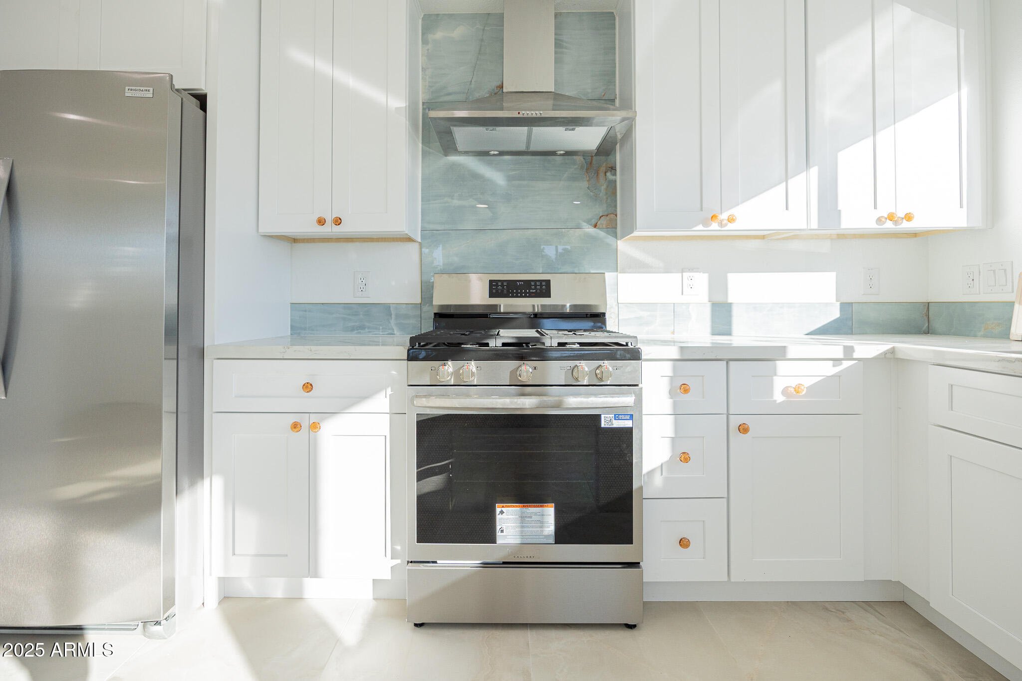 5132 South Dorsey Lane, Unit A Tempe, AZ 85282 - Photo 6 of 15 a kitchen with granite countertop a stove oven and white cabinets