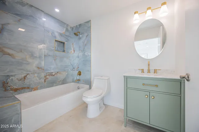 a bathroom with a sink toilet and bathtub