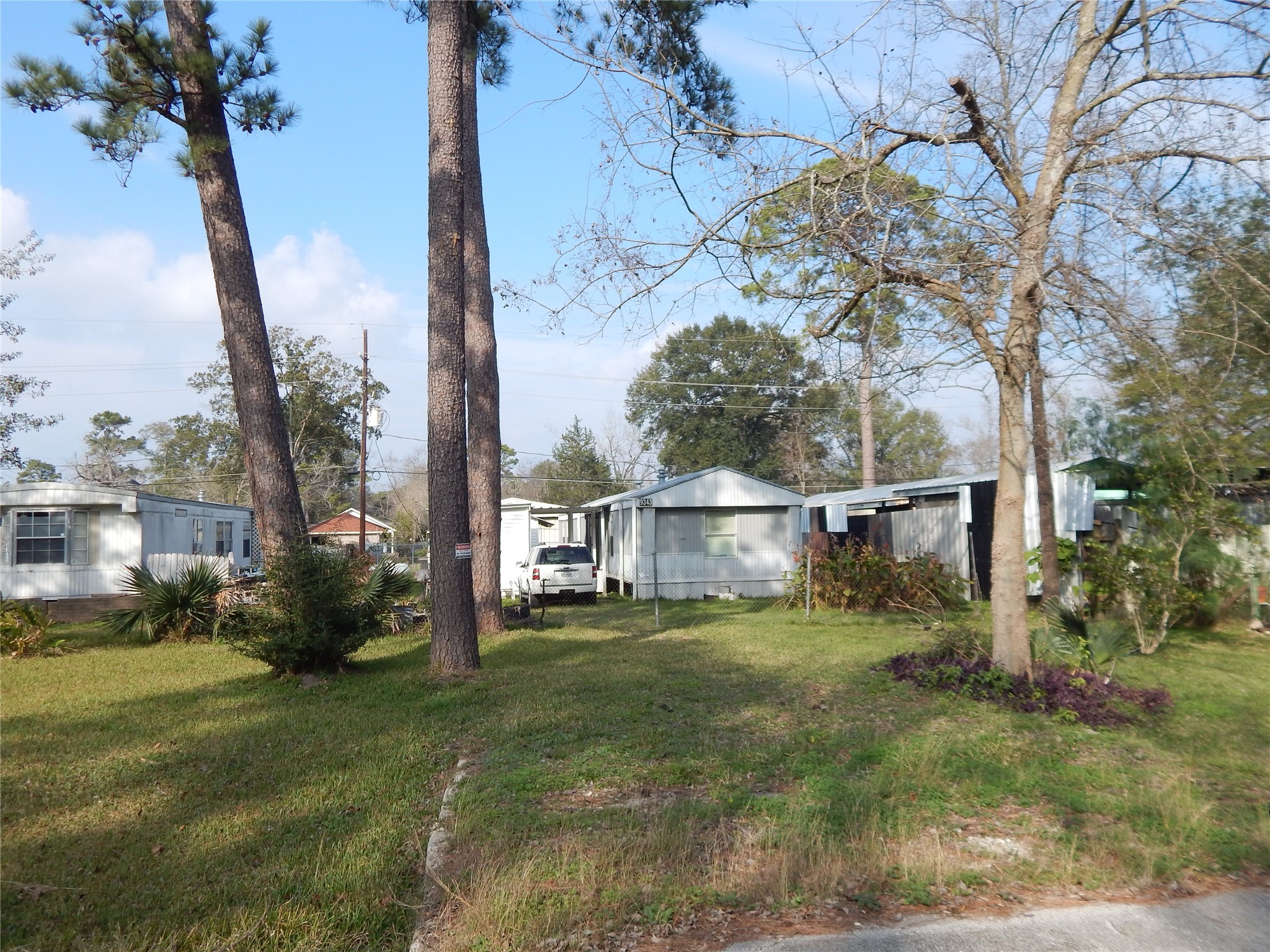 9343 Greens Road Humble, TX 77396 - Photo 1 of 16 a view of backyard with a table and chairs with wooden fence