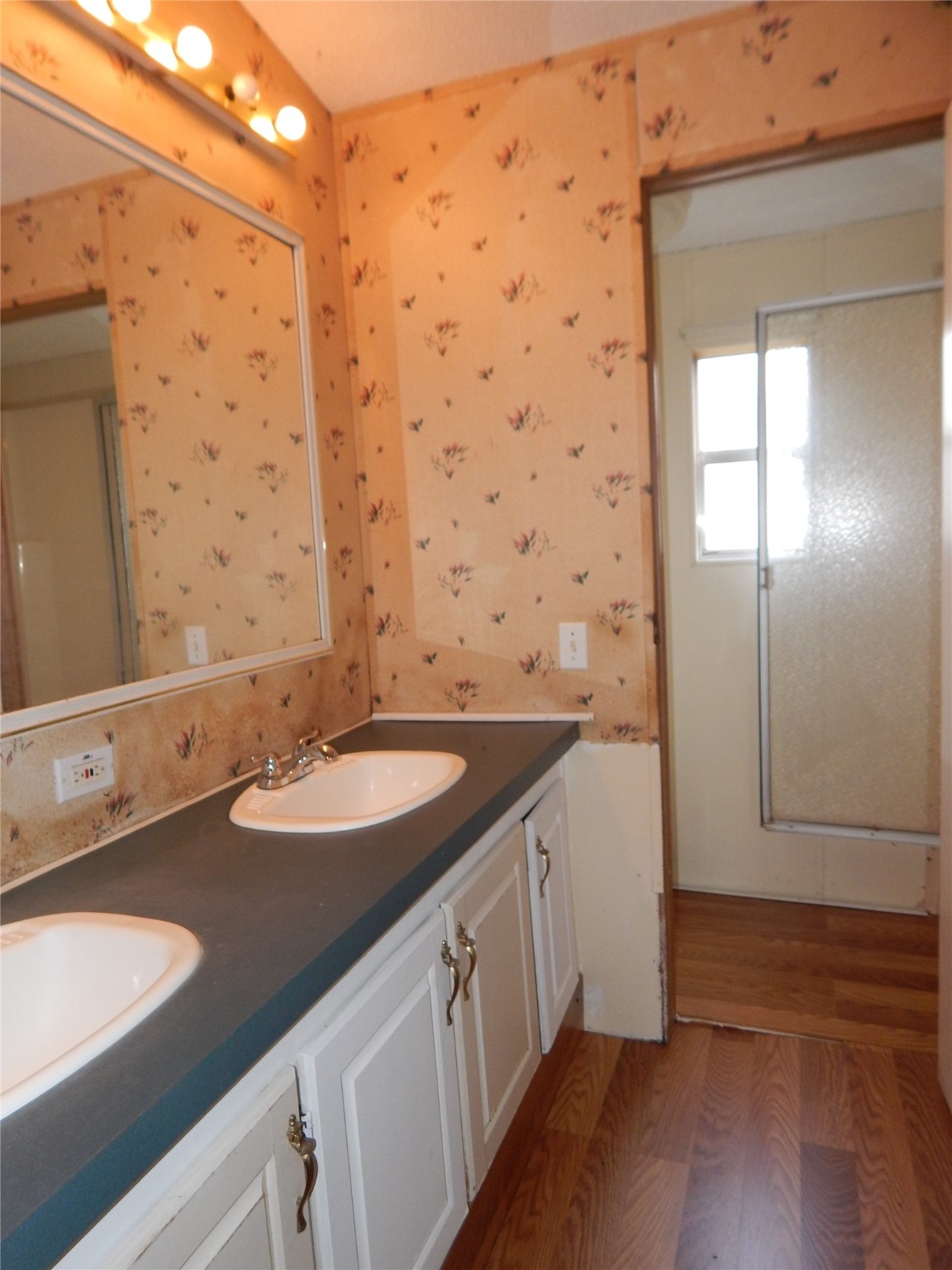 9343 Greens Road Humble, TX 77396 - Photo 14 of 16 a bathroom with a sink and a mirror