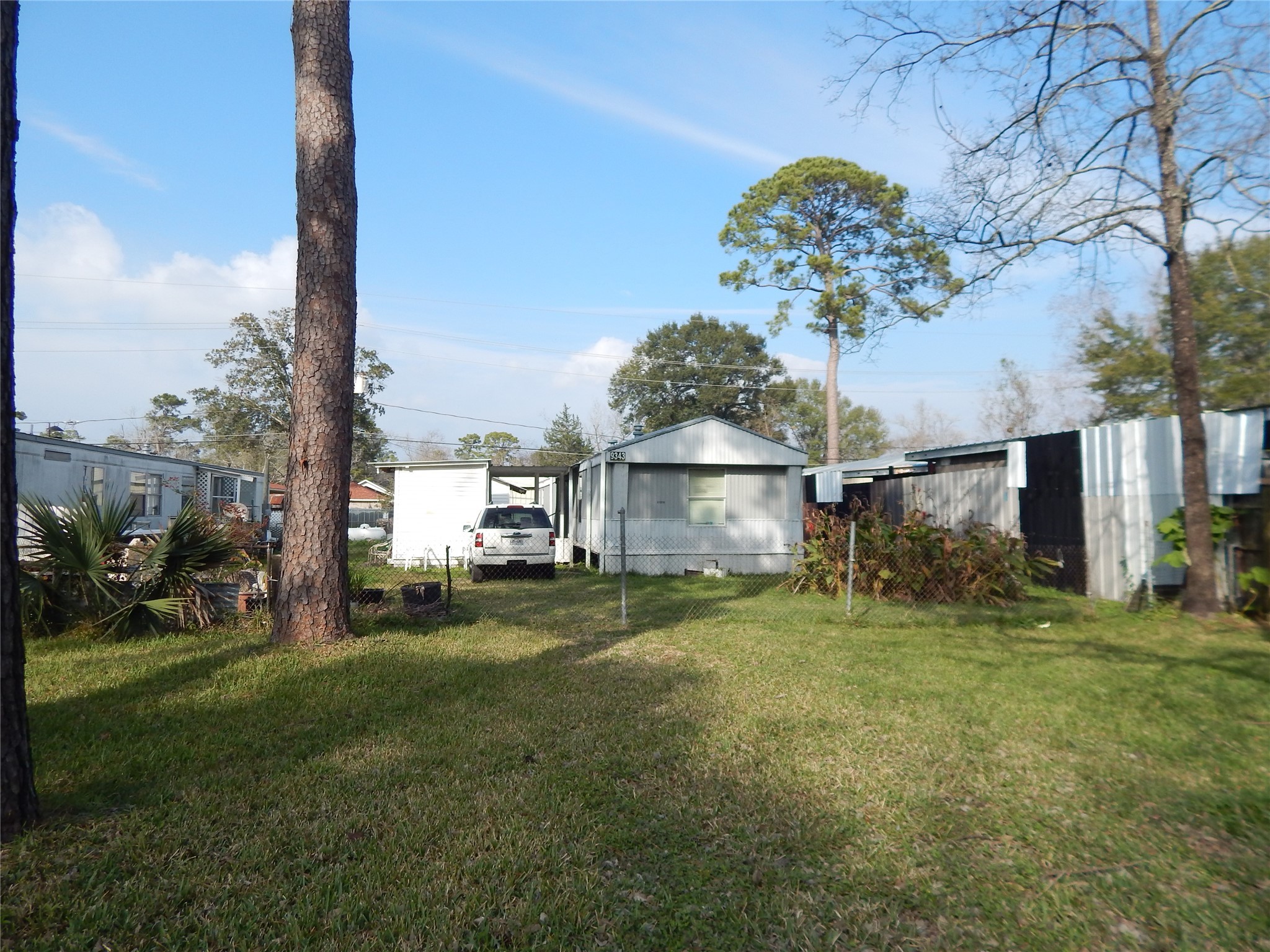 9343 Greens Road Humble, TX 77396 - Photo 2 of 16 a view of a house with a yard