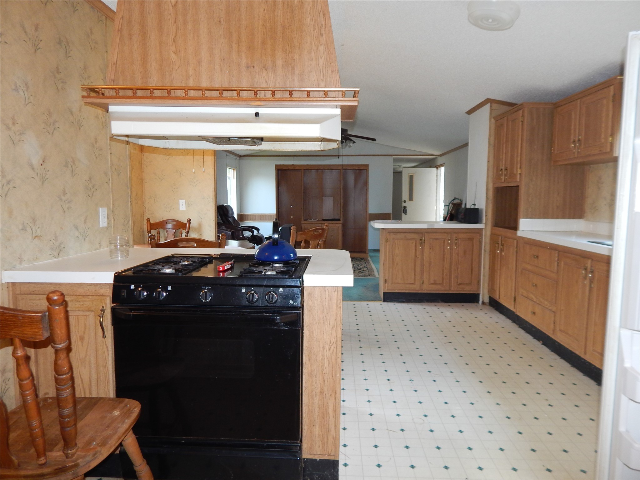 9343 Greens Road Humble, TX 77396 - Photo 9 of 16 a kitchen with a sink stove and refrigerator