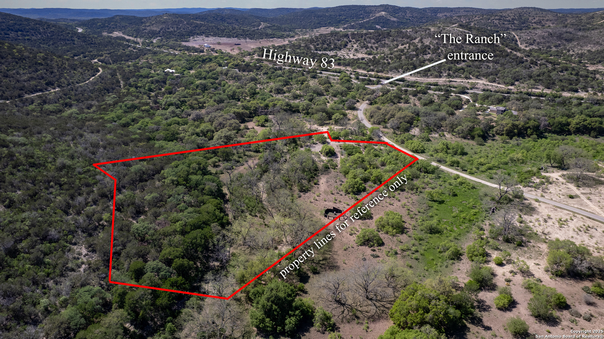8 Camino Del Rancho Concan, TX 78838 - Photo 2 of 17 an aerial view of street and residential houses