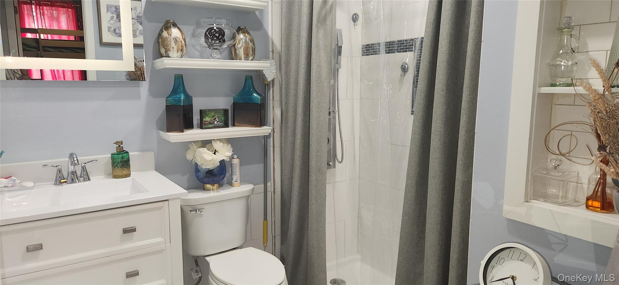 5 Magar Road Middletown, NY 10940 - Photo 17 of 31 a bathroom with a toilet sink vanity and mirror